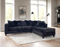 410 Black sectional with corduroy pillows