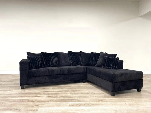410 Black sectional with corduroy pillows